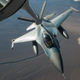 Illustration for article titled Check Out This Aggressor F-16 Refueling Over A Sandstorm